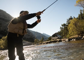 A man is fishing in a river